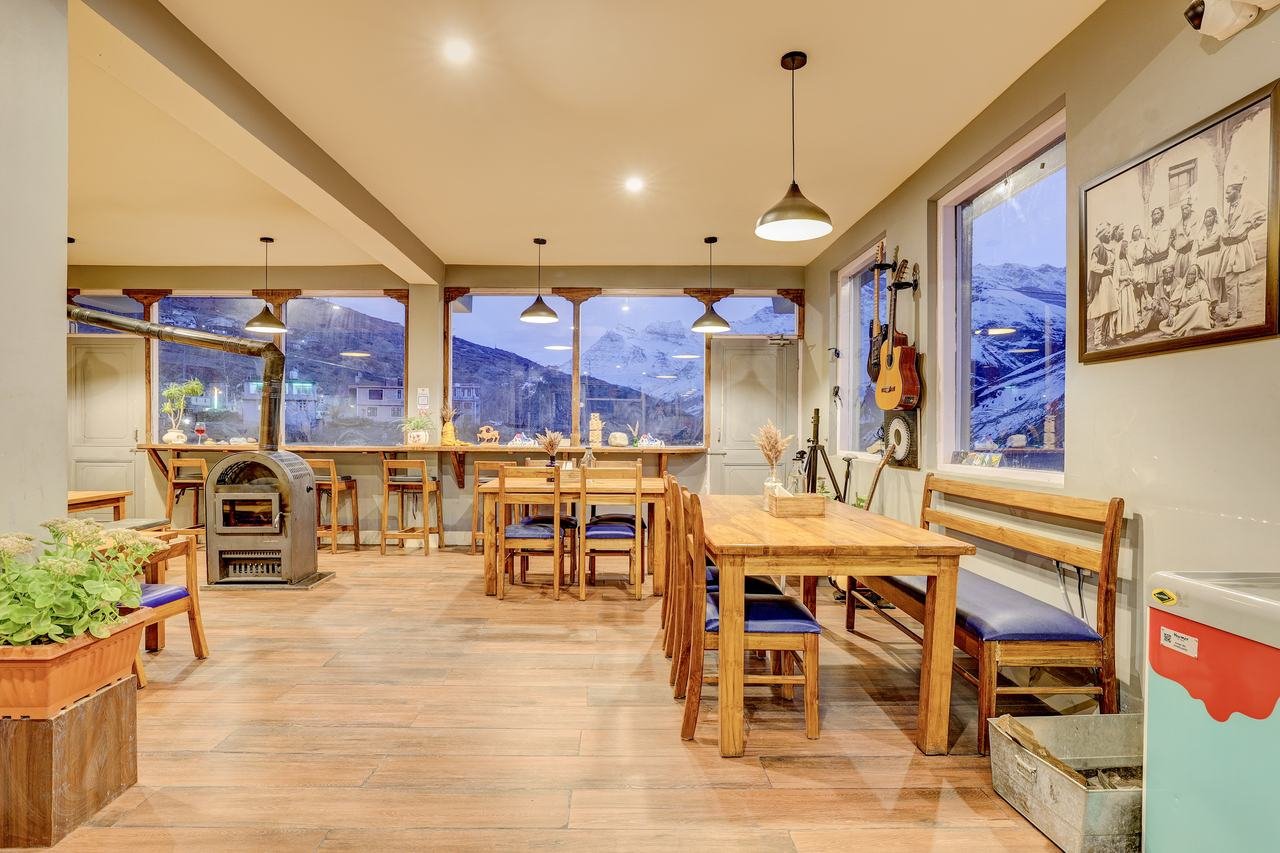 Oven Xpress dining area with wood stove
